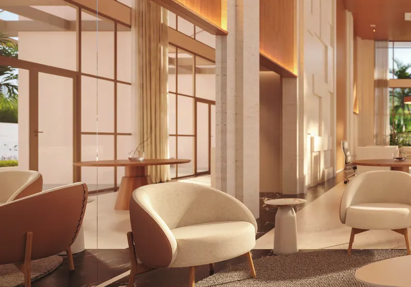 Lobby do ORO Ilha Pura by Ornare com pé-direito alto, madeira e poltronas